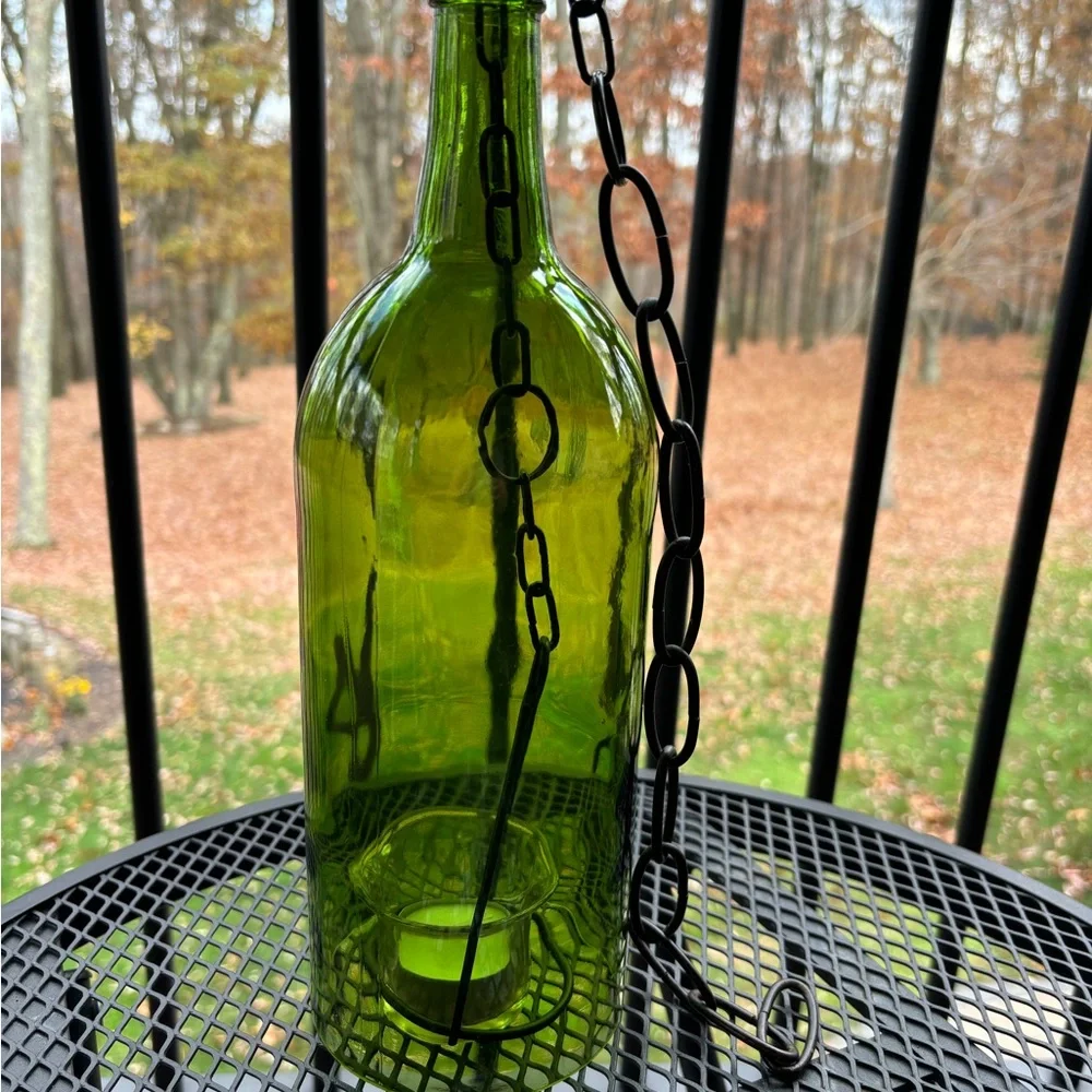 Hanging wine bottle with candle